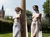 Beautiful two women, tied up to a medieval pole,