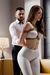 AI beauty in white leggings rope tied