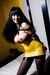 Black haired girl tied up in yellow latex dress