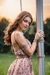 Busty woman in loose sundresses is being tied up