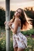 Busty woman in loose sundresses, tied up to the