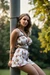Busty woman in loose sundresses is being tied up