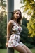 Busty woman in loose sundresses is being tied up