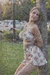 Busty woman in loose sundresses is being tied up