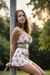 Busty woman in loose sundresses is being tied up
