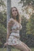 Busty woman in loose sundresses is being tied up
