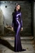 Gagged girl posing in purple latexdress