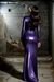Ballgagged girl posing in purple latex dress