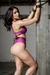 AI generated woman struggling tied up to a pole